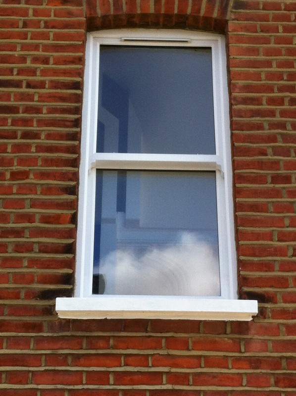 uPVC sash window on Victorian red brick house in South Woodford